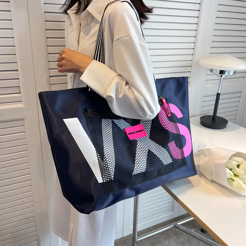 DEEP BLUE waterproof nylon tote bag with white letter print and pink logo tag