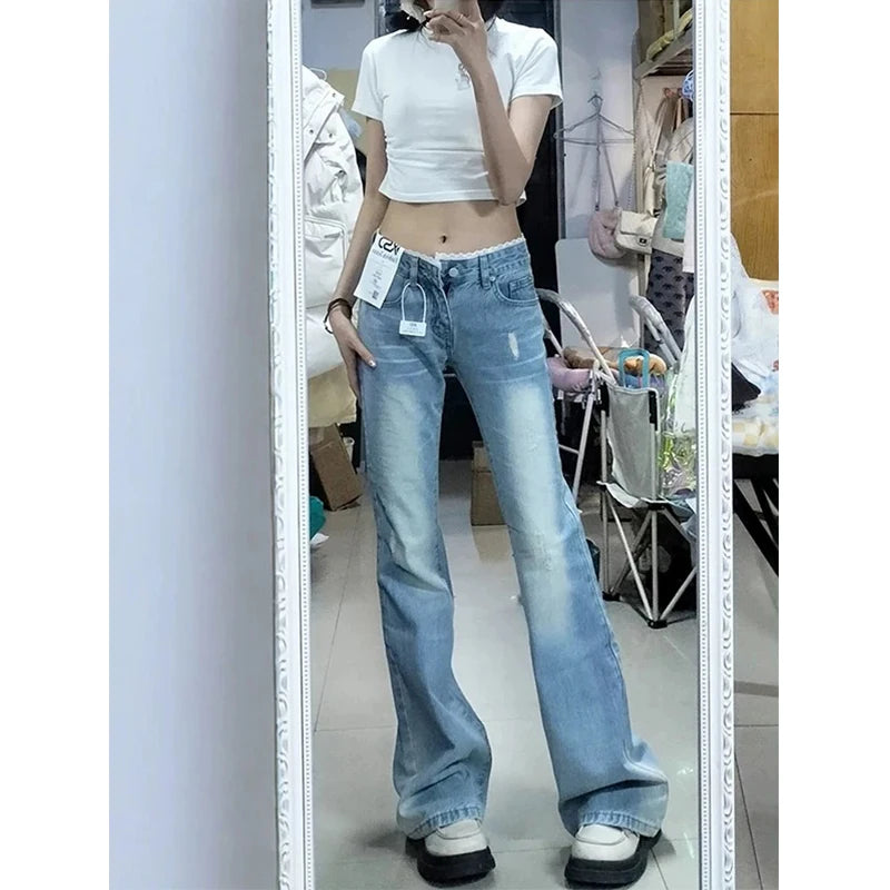 Light blue plus-size jeans with straight legs; mid-rise waistband and belt loops