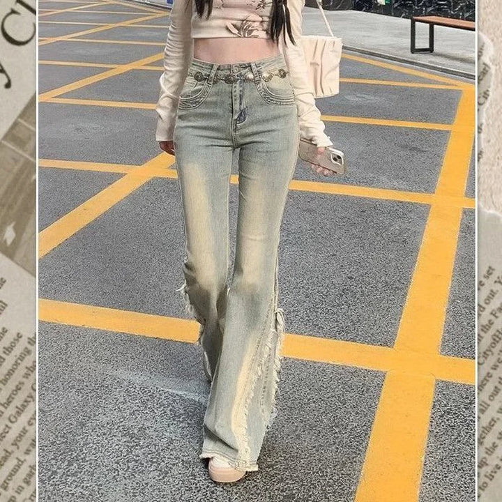 High-waist light blue jeans with decorative front pockets and raw flared hem
