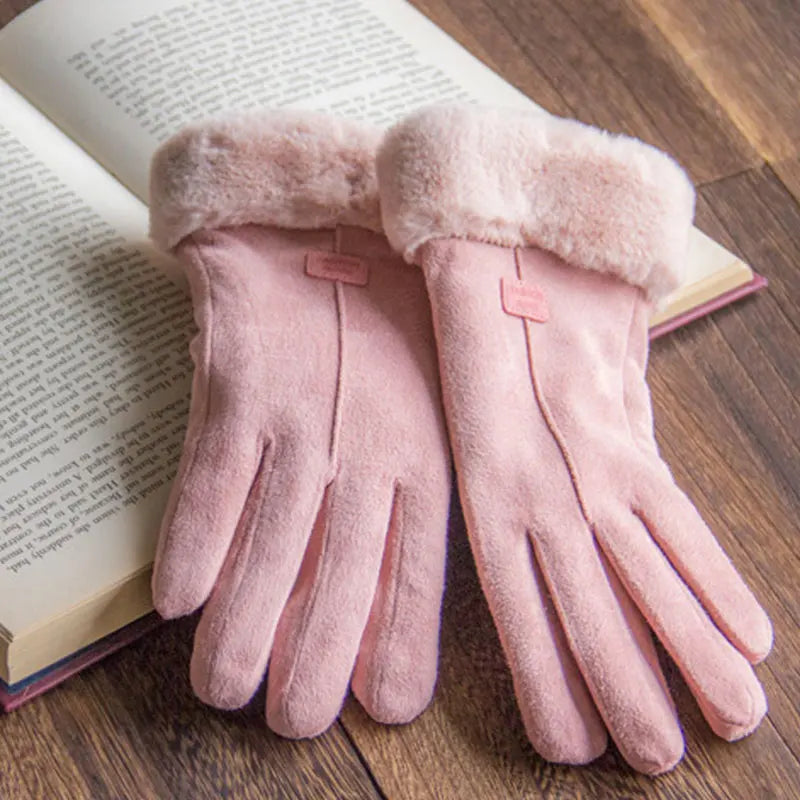 Pair of pink gloves with plush cuffs and stitched front seams