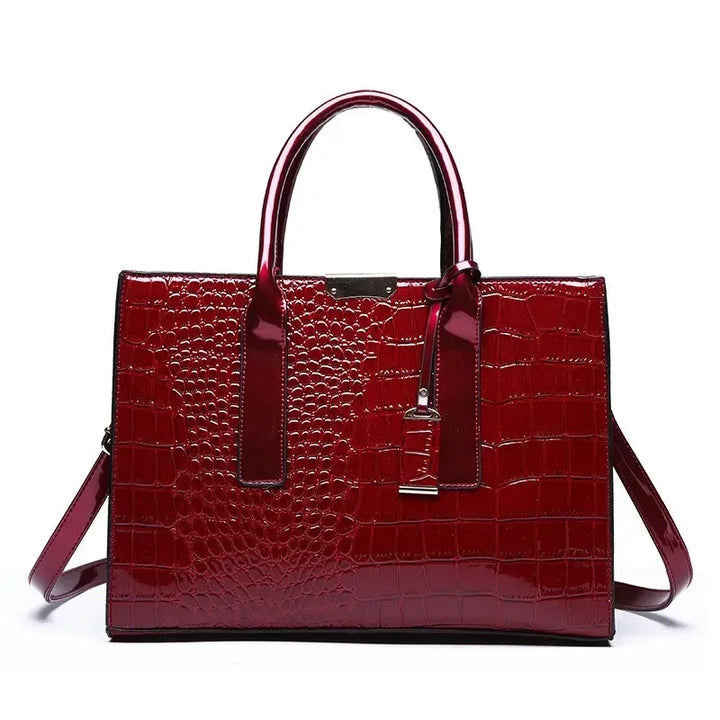 Crocodile-pattern leather tote handbag with top handles and shoulder strap, wine red.