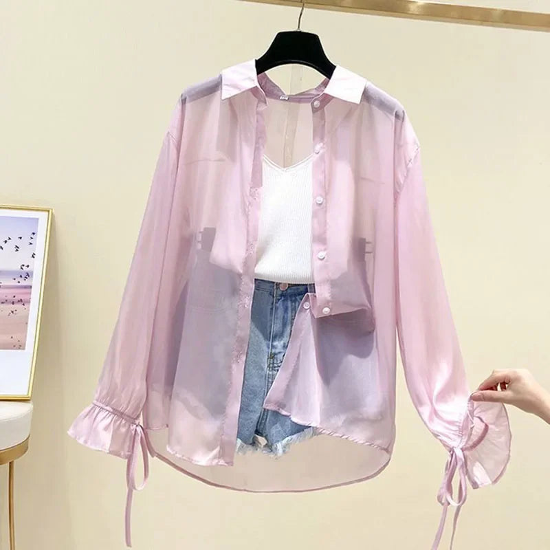 Pink sheer button-up long sleeve shirt with ruffled cuffs and drawstring ties