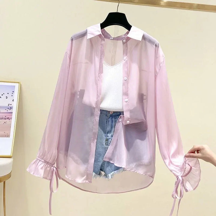 Pink sheer button-up long sleeve shirt with ruffled cuffs and drawstring ties