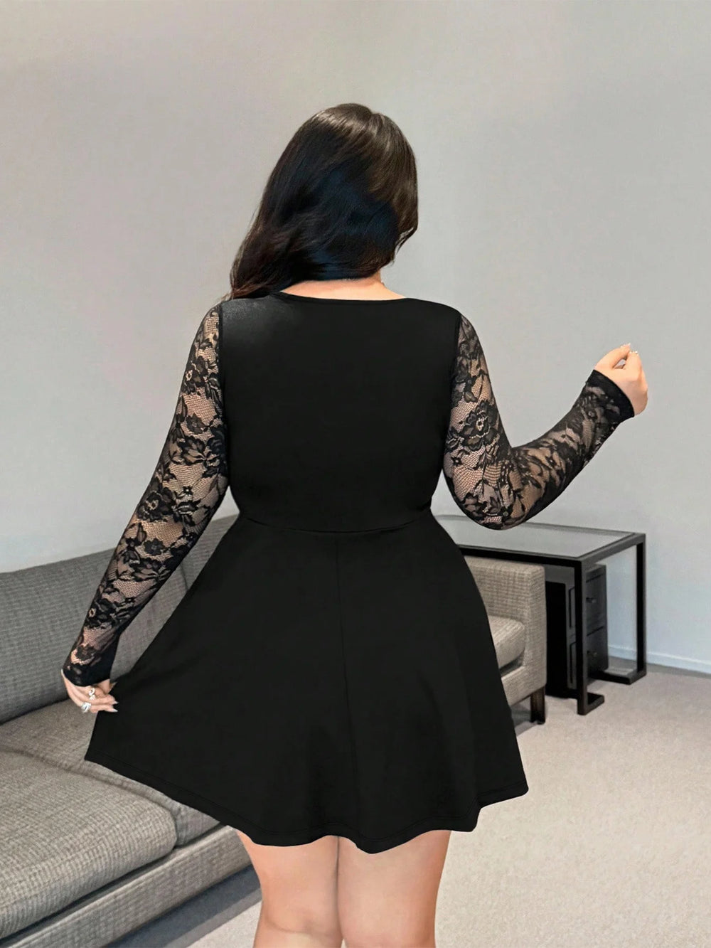 Black lace long sleeve mini dress, open back and flared skirt