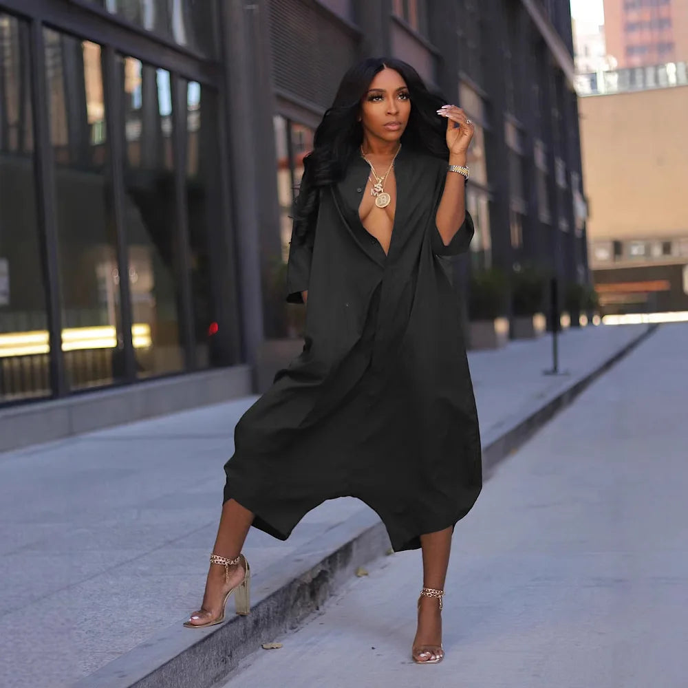 Black blazer-style jumpsuit with V-neck, loose fit, and wide legs