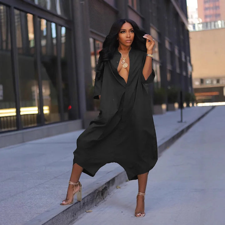 Black blazer-style jumpsuit with V-neck, loose fit, and wide legs