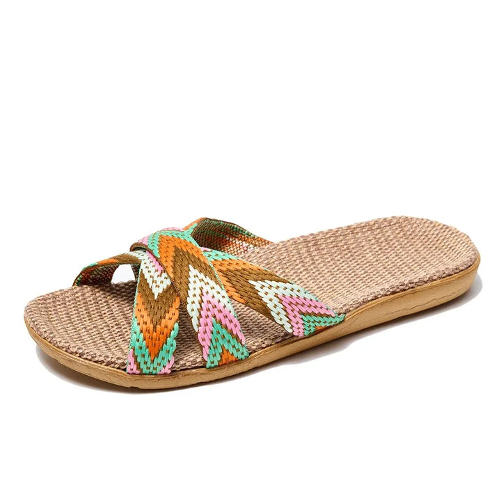 Woven sandal with colorful straps on a white background