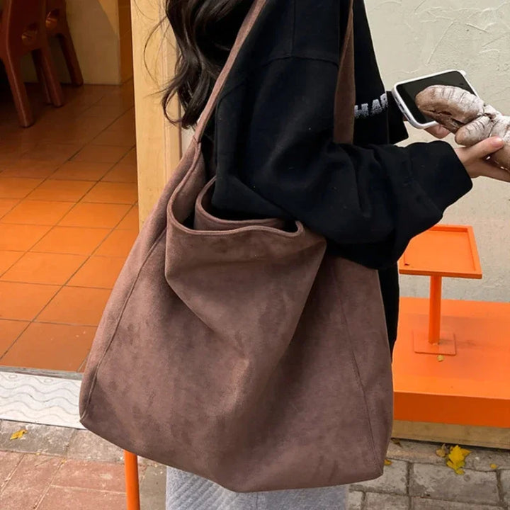 Taupe suede-look underarm tote bag with open top and wide short handles