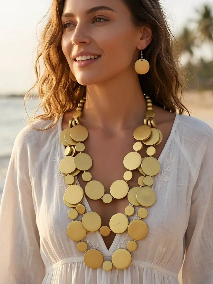 Gold-tone multilayer round beaded necklace with matching dangling earrings