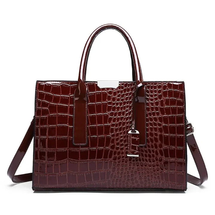 Crocodile-pattern leather tote handbag with top handles and shoulder strap, deep brown.