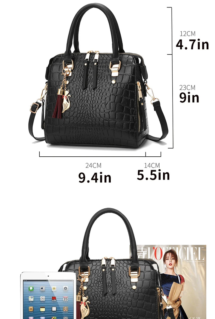 Black handbag with measurements and a magazine in the background