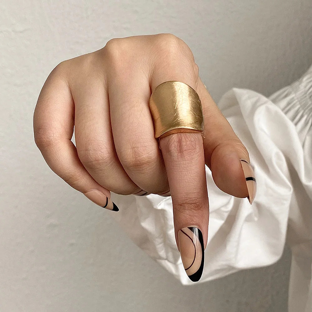 Gold chunky band-style ring with rounded top, adjustable fit