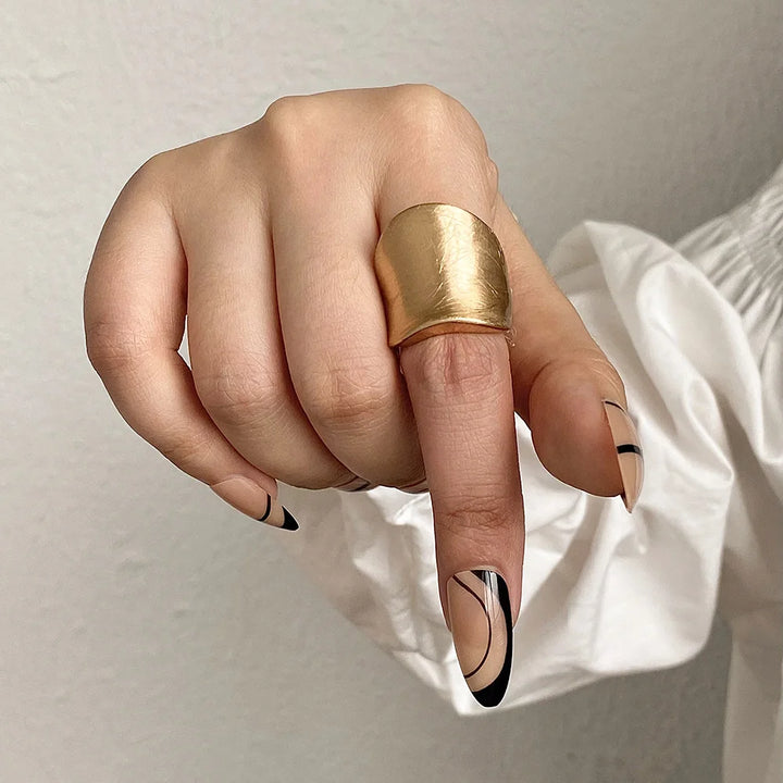 Gold chunky band-style ring with rounded top, adjustable fit