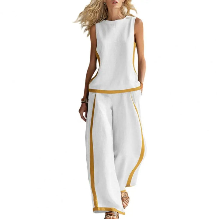 White sleeveless vest and wide-leg pants set with gold trim, front view