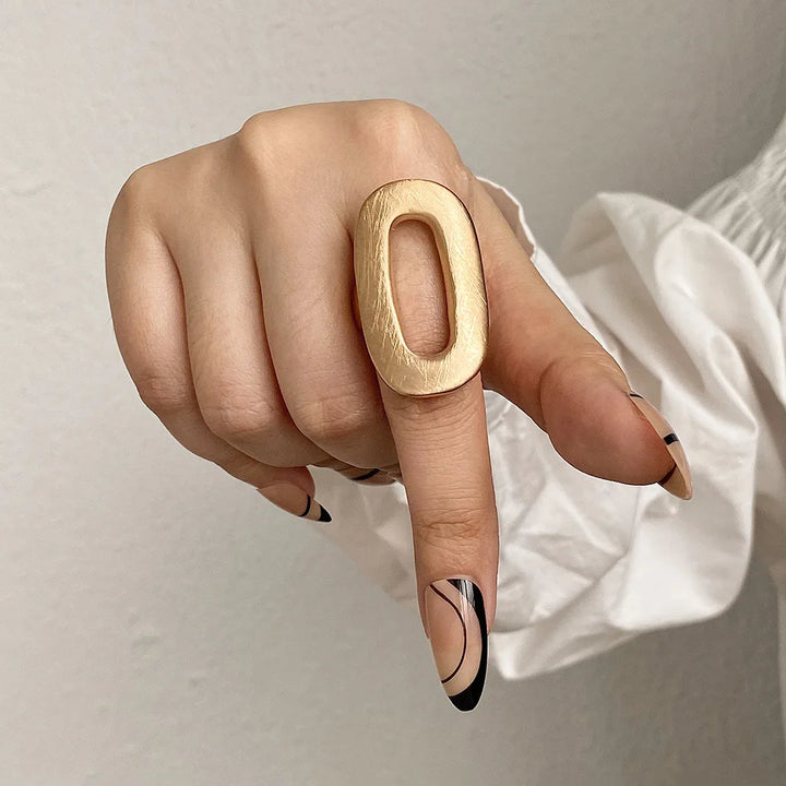 Gold tone oval statement mood ring with open center on adjustable band