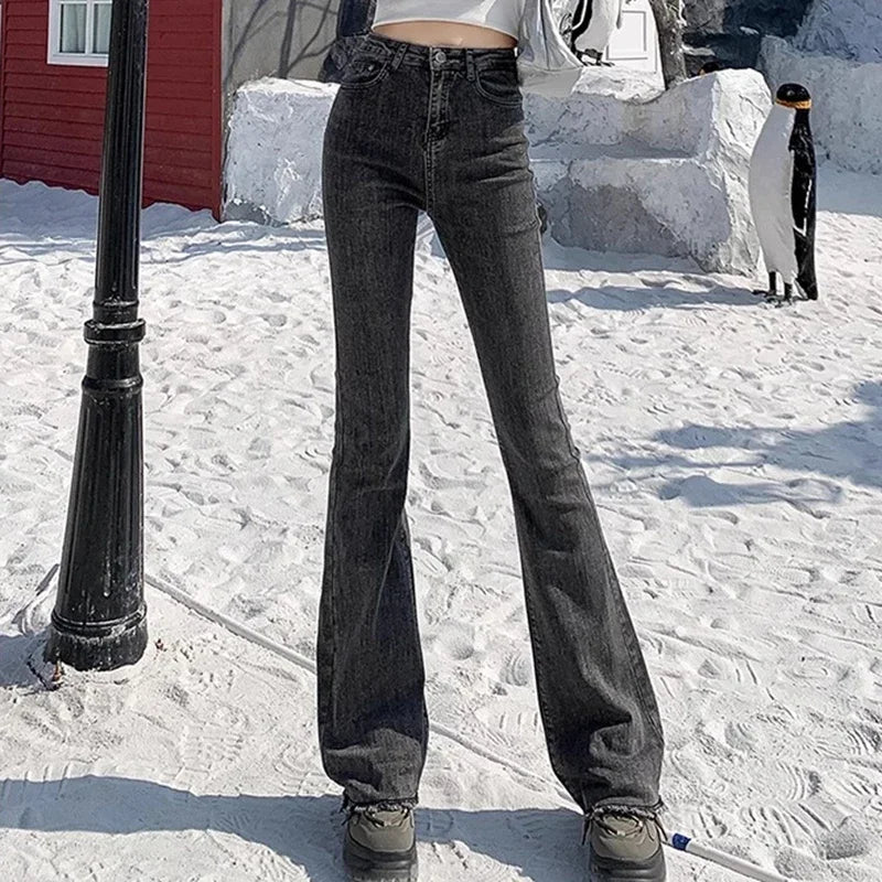 High-rise flare denim jeans, dark grey/black wash, classic denim seams and button