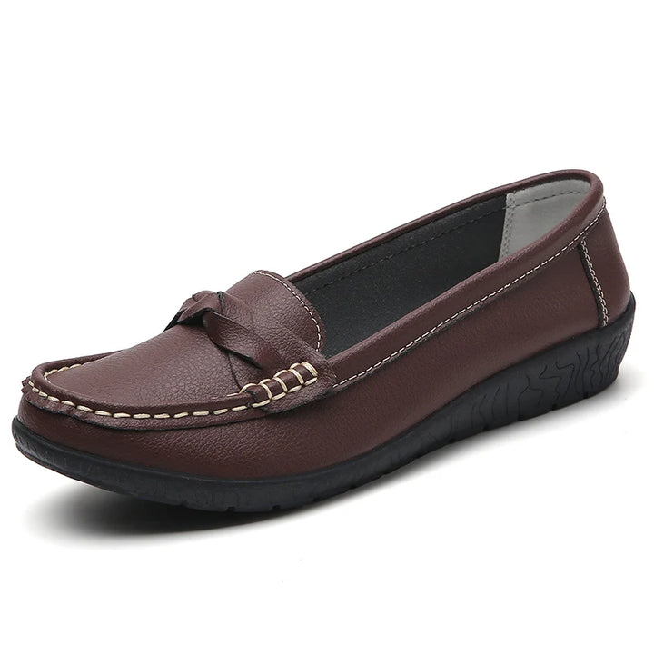 Brown leather loafer shoe on a white background