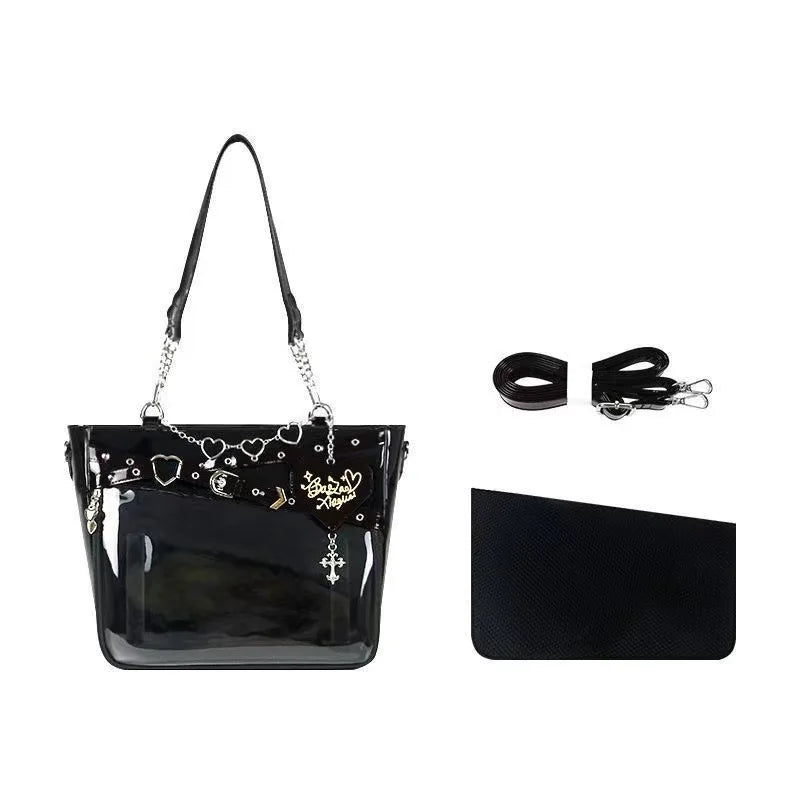 Black PU leather shoulder tote with chain heart trim, stud details, and zip closure