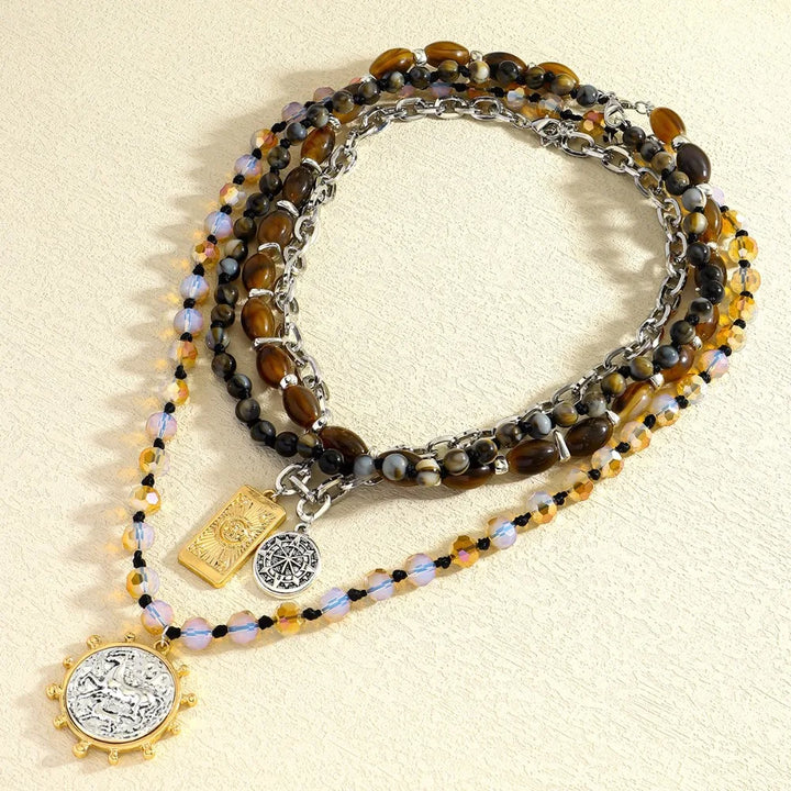 Multi-strand beaded necklace with tiger-eye and iridescent beads; square and coin charms
