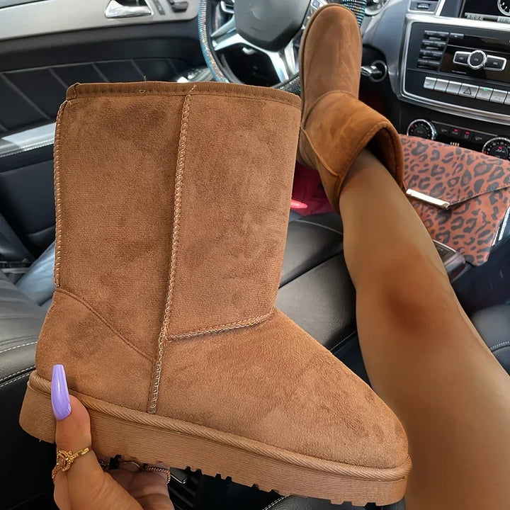 Beige corduroy mid-calf platform snow boots with plush lining, side view