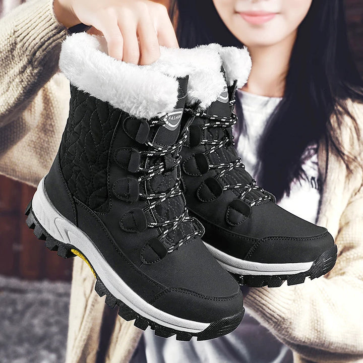 Women's black mid-calf lace-up snow boots with thick fleece lining and grippy outsole