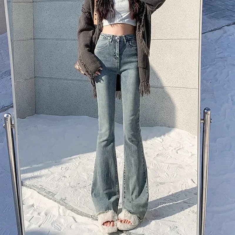 High-rise flare denim jeans, light blue wash, straight hips with flared legs