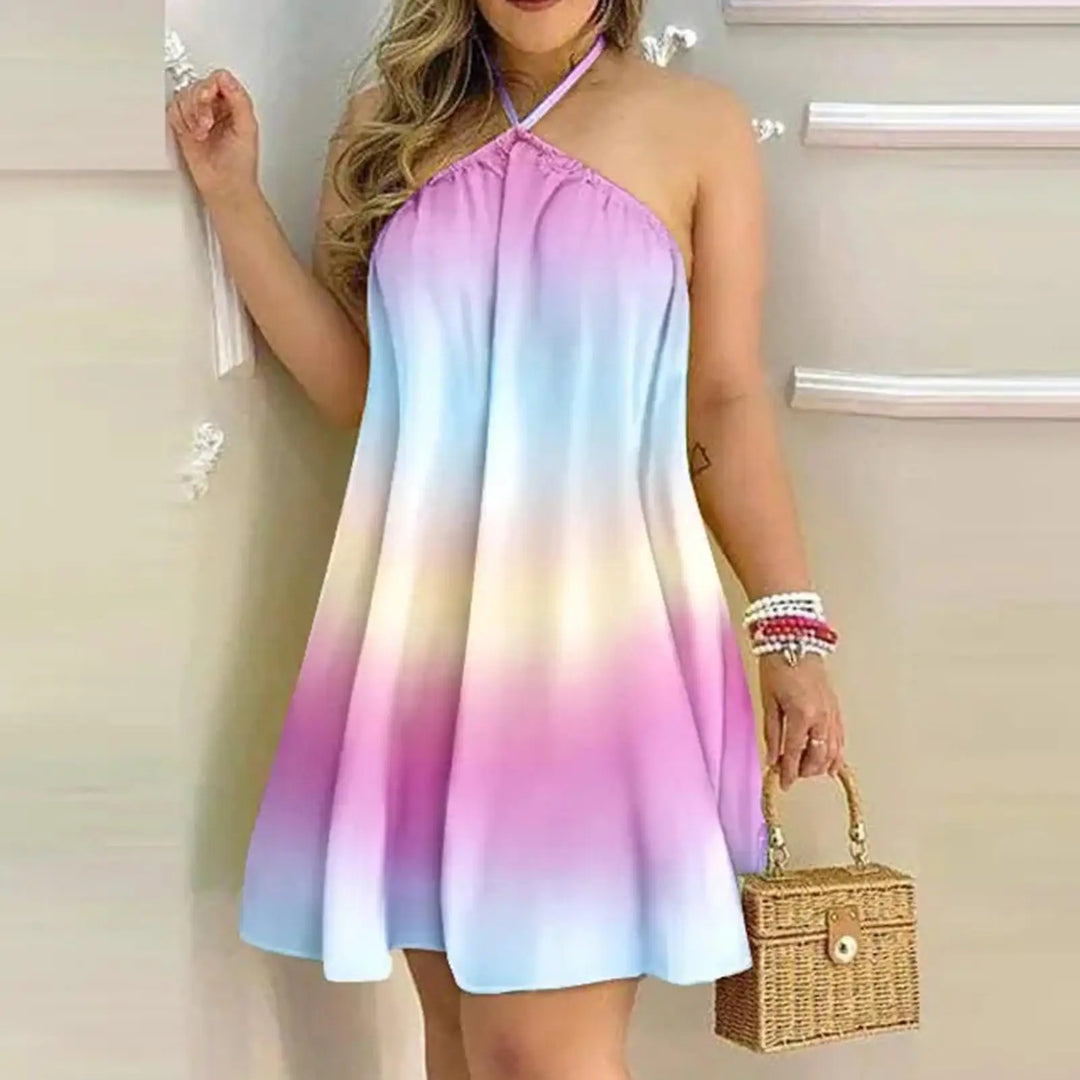 Woman wearing a colorful gradient dress holding a woven bag indoors.