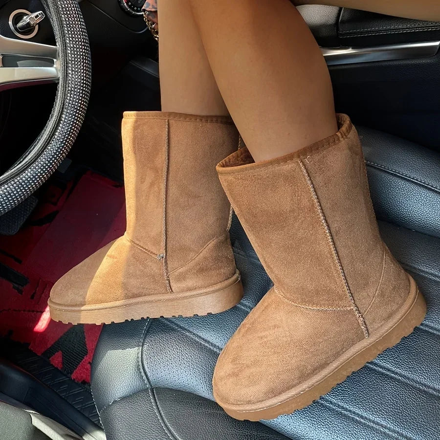 Beige corduroy mid-calf platform snow boots, side-by-side on seat