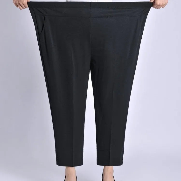Black wide-leg ankle crop pants with elastic waistband and high rise