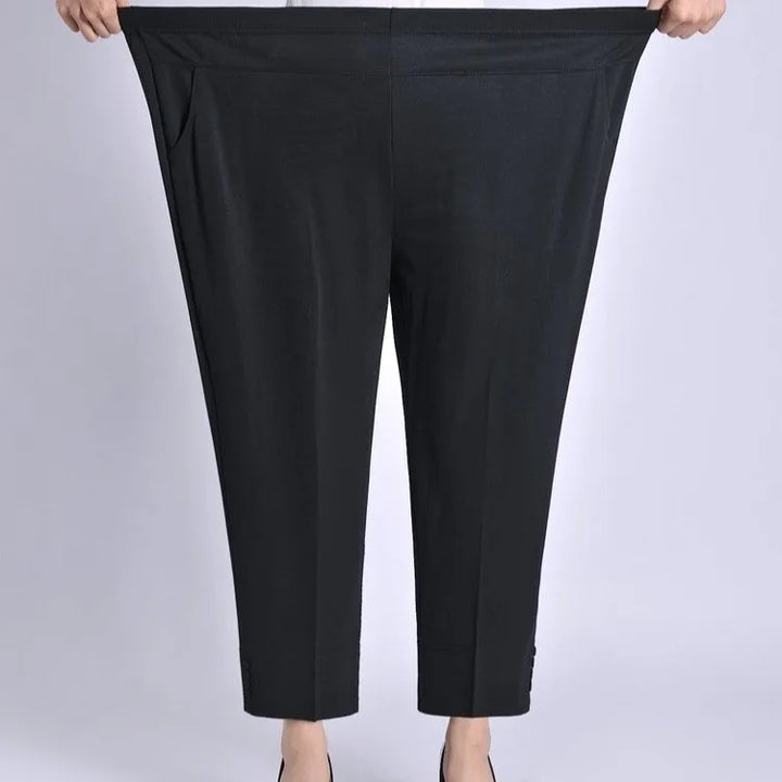 Black wide-leg ankle crop pants with elastic waistband and high rise