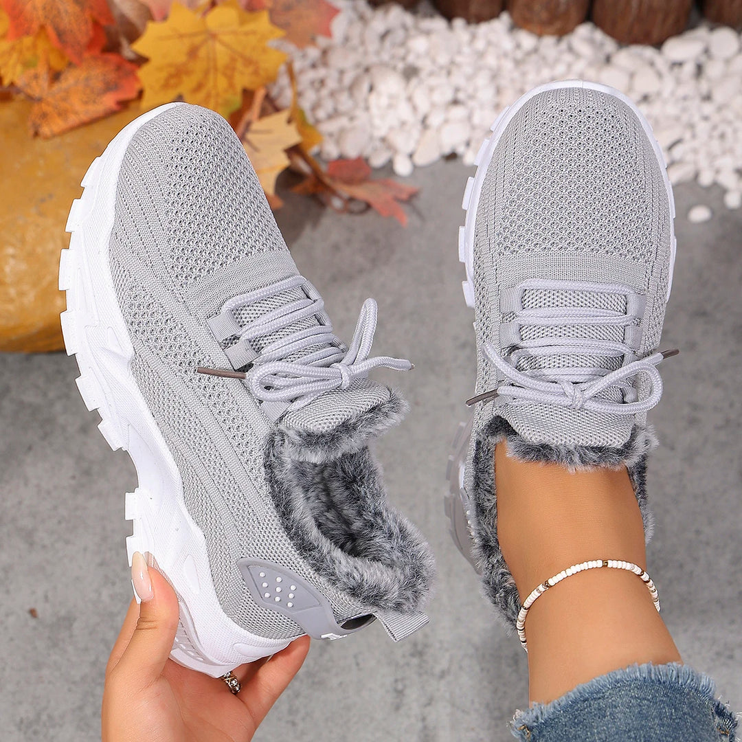 Women’s light gray knit lace-up snow sneakers with plush gray lining and chunky sole