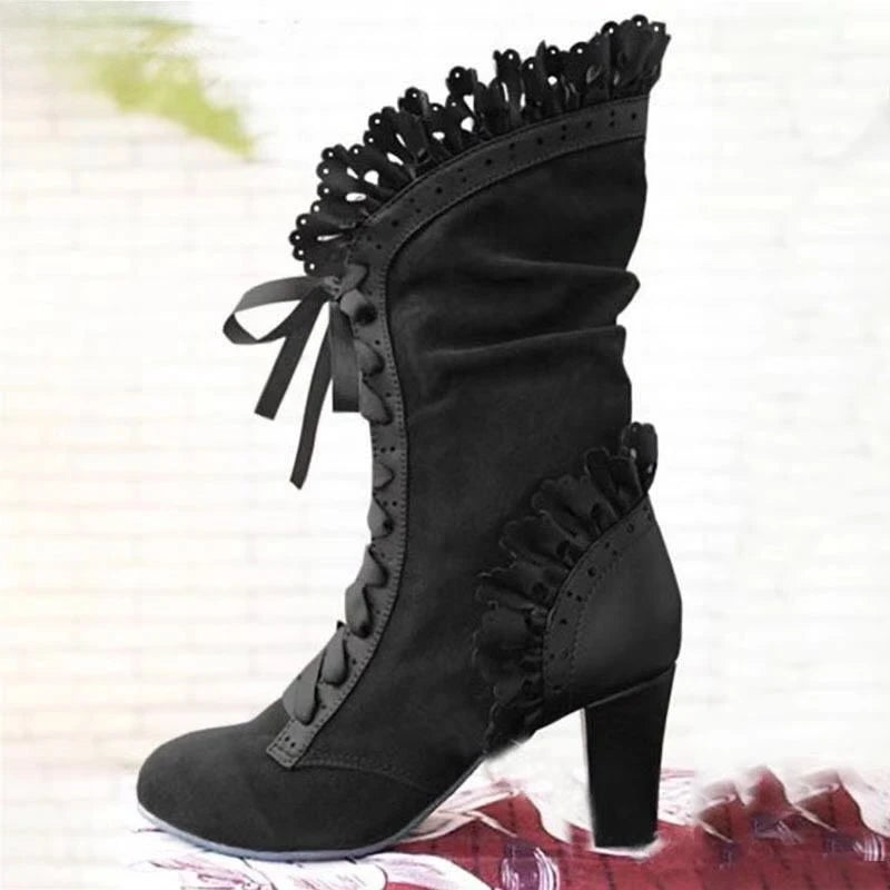 Black mid-calf lace-up high-heel boots with ruffled trim and lace bow accents