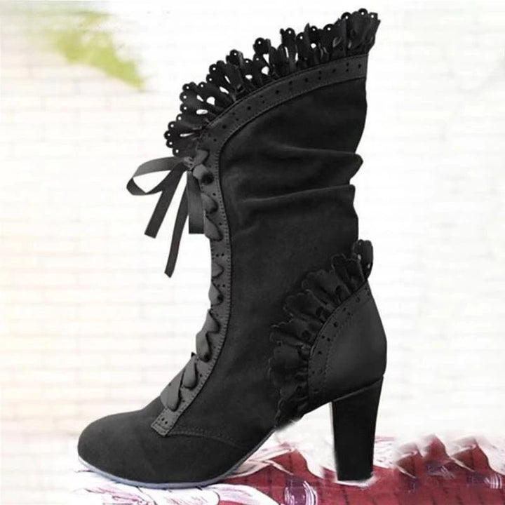 Black mid-calf lace-up high-heel boots with ruffled trim and lace bow accents