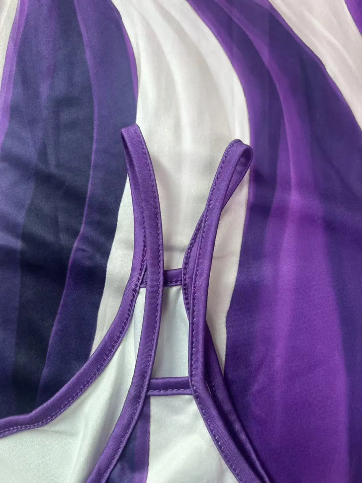 Close-up of a purple bikini top on a white background