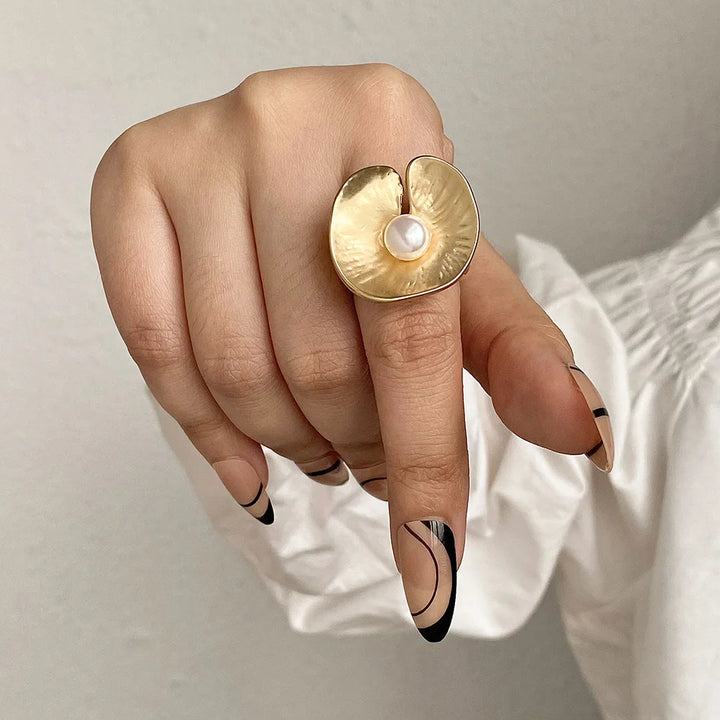 Gold tone large flower mood ring with white pearl center on adjustable band