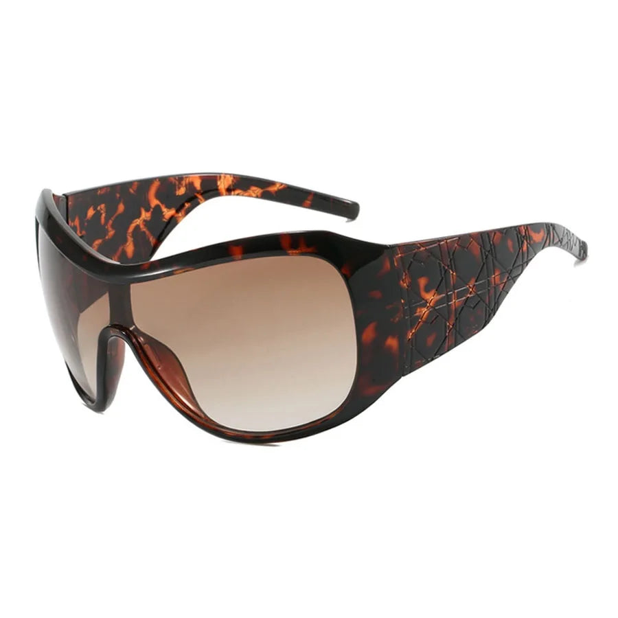 Sunglasses with tortoiseshell frame and brown lens on a white background