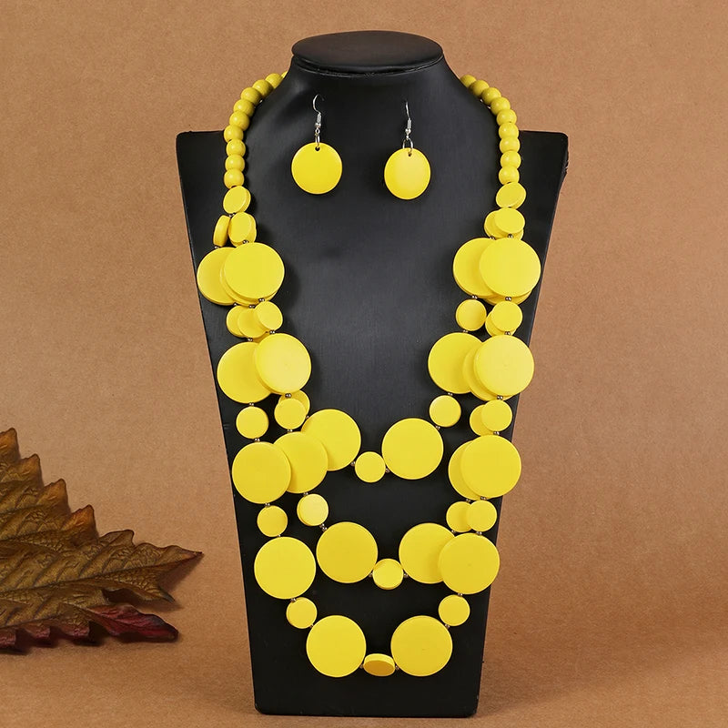 Bright yellow multilayer disc beaded necklace with round dangle earrings