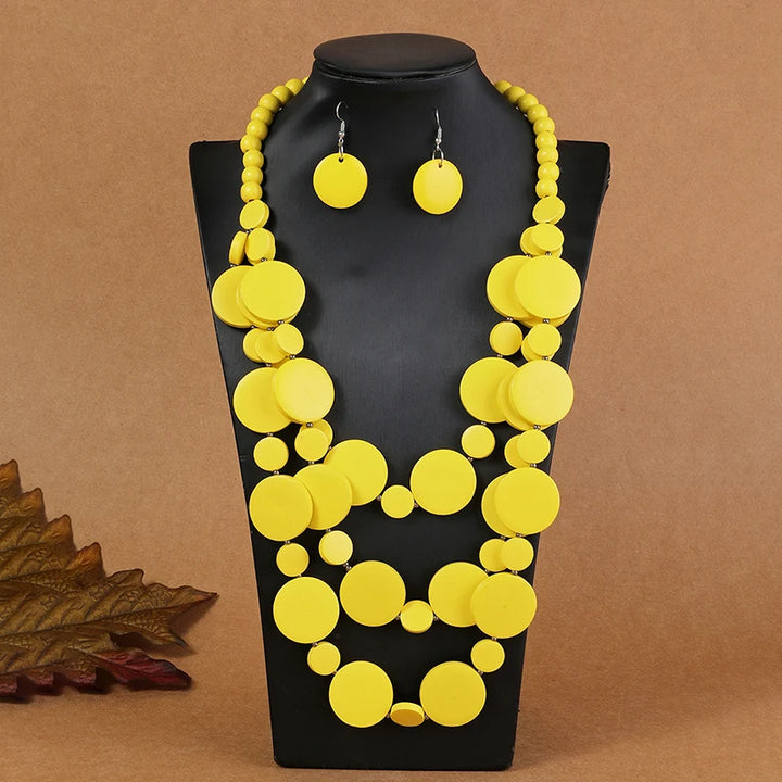 Bright yellow multilayer disc beaded necklace with round dangle earrings