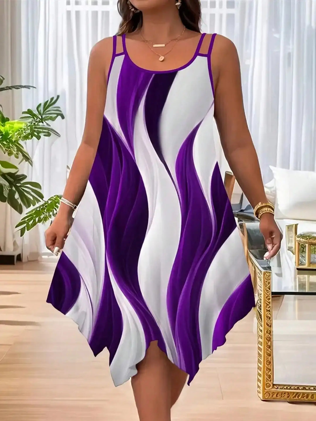 Woman wearing a purple and white dress in a living room setting