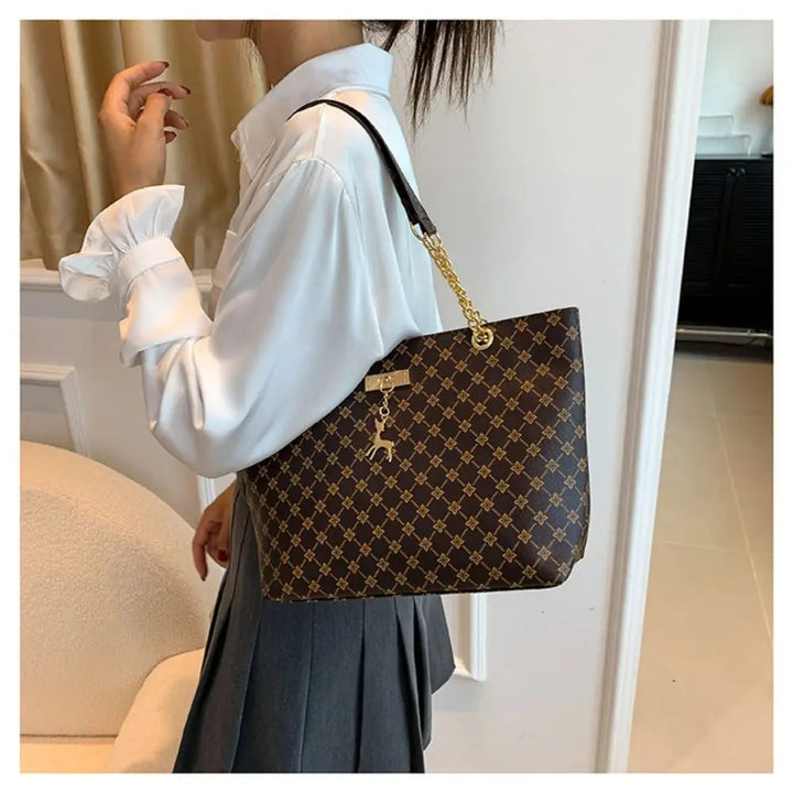 Large patterned bucket tote bag with chain handles and top clasp, dark brown