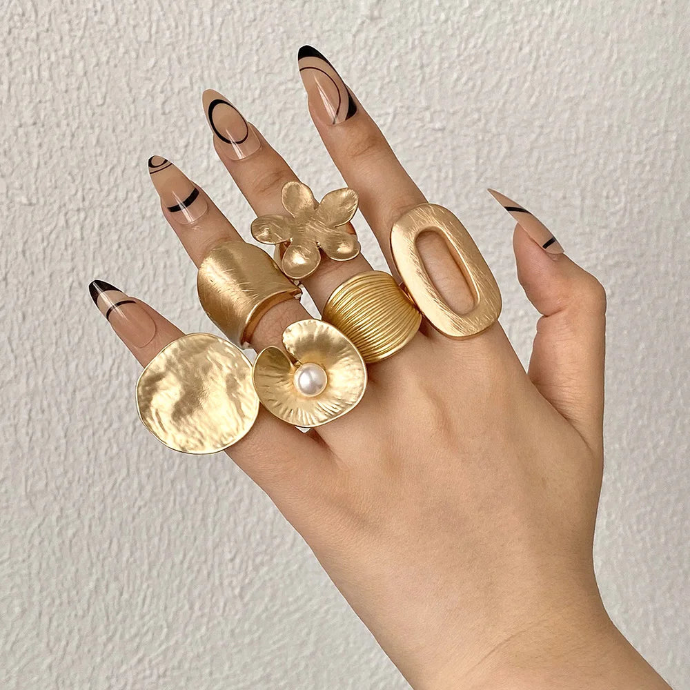 Gold tone chunky mood rings with floral and oval statement tops