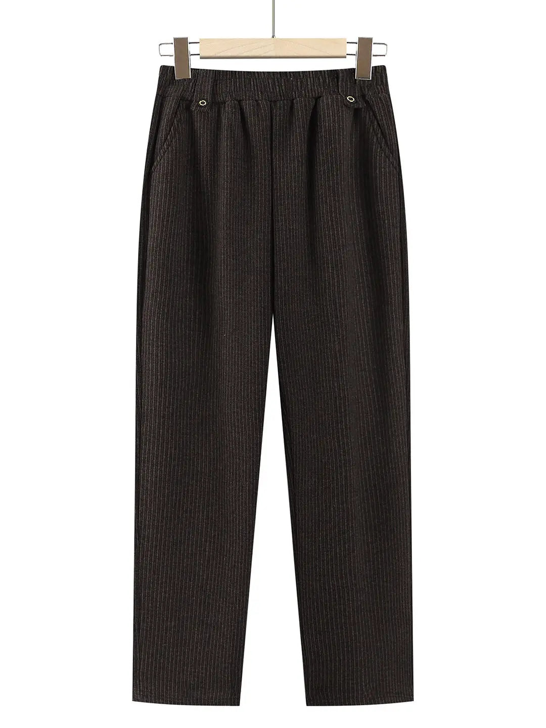 Dark brown vertically ribbed wide-leg trousers hanging from a wooden hanger against a plain white background.