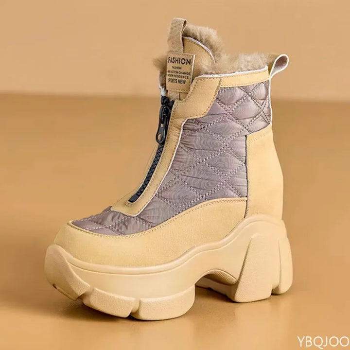 Beige winter boot with quilted design on a beige background