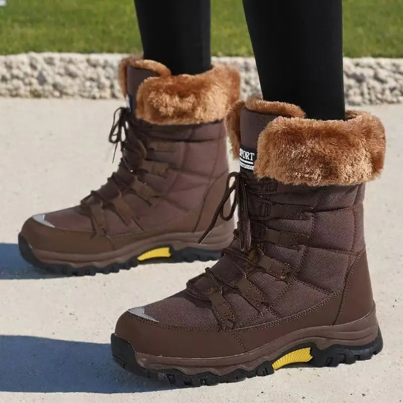 Women’s winter snow boots in dark brown with lace-up front and plush cuff trim.