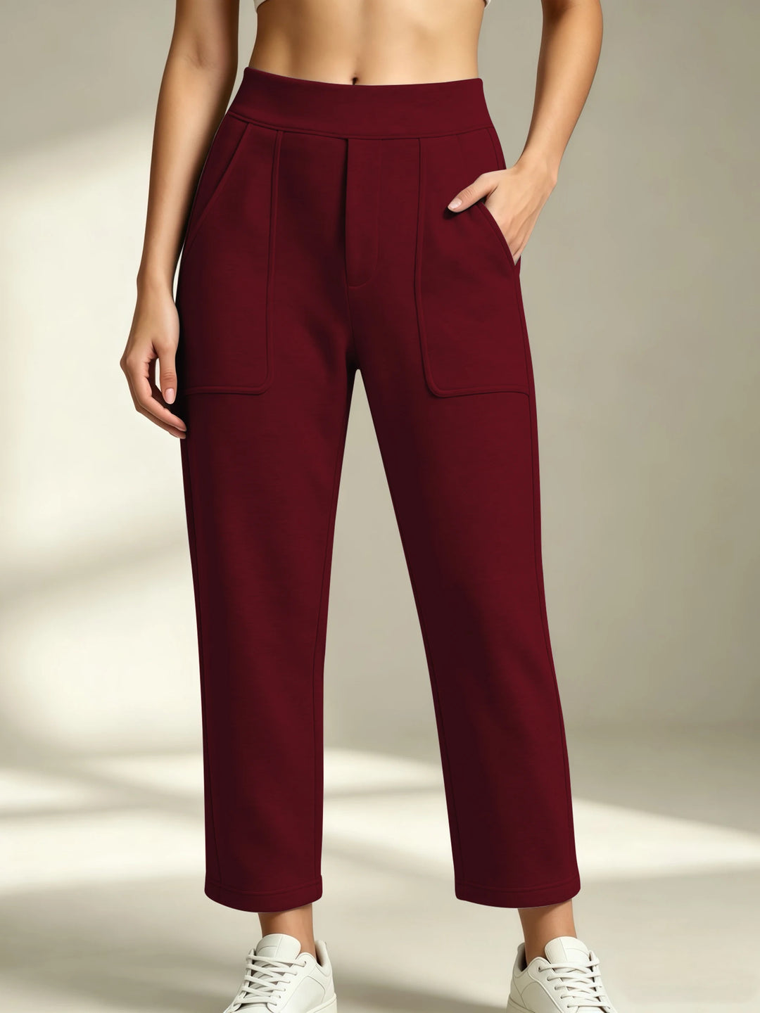 Women's burgundy straight-leg sweatpants with an elastic waist and front patch pockets