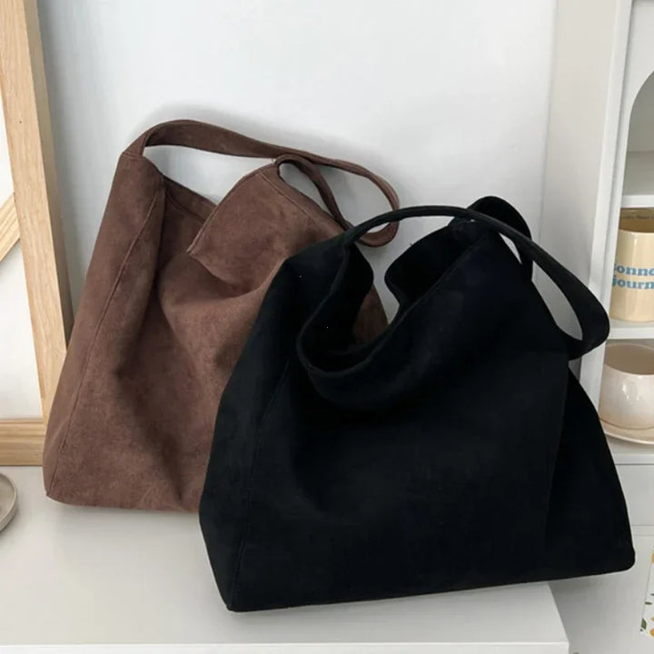 Brown and black suede-look underarm tote bags with open top and short handles