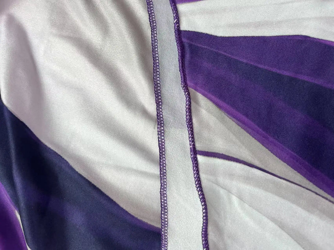 Close-up of a garment with purple and white pattern