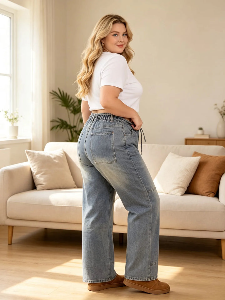 Light blue denim cargo jeans with drawstring waist, relaxed fit, and side seam details