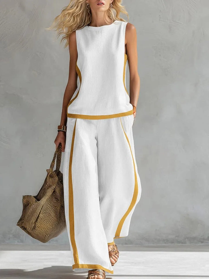 White sleeveless tank and wide-leg pants set with contrast yellow side piping.