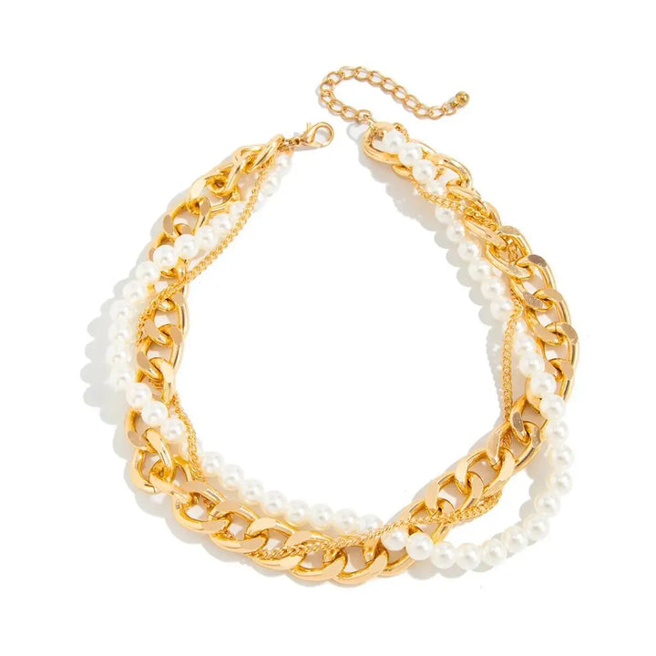 Gold chain necklace with white beads on a white background